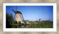 Traditional windmills in a field, Netherlands Fine Art Print