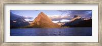 Sunlight falling on mountains at the lakeside, Swiftcurrent Lake, Many Glacier, US Glacier National Park, Montana, USA Fine Art Print