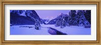Lake in winter with mountains in the background, Lake Louise, Banff National Park, Alberta, Canada Fine Art Print