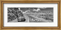 Vintage car moving on Route 66 in black and white, Arizona Fine Art Print