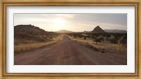Dirt road passing through a desert, Namibia Fine Art Print