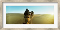 Row of people riding camels through the desert, Sahara Desert, Morocco Fine Art Print