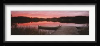 Canoe tied to dock on a small lake at sunset, Sweden Fine Art Print