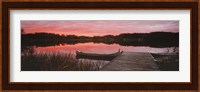 Canoe tied to dock on a small lake at sunset, Sweden Fine Art Print