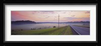 Country road and telephone lines splitting farmlands at dawn, Finland Fine Art Print