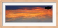 Reflection of clouds with circular ripples spreading outward across glassy lake waters at sunset Fine Art Print