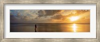 Woman standing on sandbar looking at sunset, Aitutaki, Cook Islands Fine Art Print