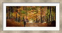 Kid with backpack walking in fall colors Fine Art Print