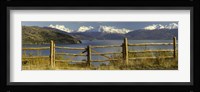 Fence in front of a lake with mountains in the background, Lake General Carrera, Andes, Patagonia, Chile Fine Art Print