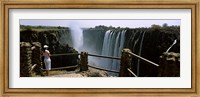 Woman looking at the Victoria Falls from a viewing point, Zambia Fine Art Print