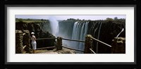 Woman looking at the Victoria Falls from a viewing point, Zambia Fine Art Print