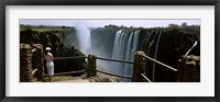 Woman looking at the Victoria Falls from a viewing point, Zambia Fine Art Print