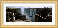 Woman looking at the Victoria Falls from a viewing point, Zambia Fine Art Print