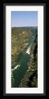 Kayakers paddle down the Zambezi gorge away from the Victoria Falls, Zambia Fine Art Print