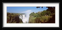 Tourists at a viewing point looking at the rainbow formed over Victoria Falls, Zimbabwe Fine Art Print