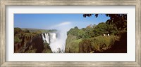Tourists at a viewing point looking at the rainbow formed over Victoria Falls, Zimbabwe Fine Art Print
