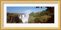 Tourists at a viewing point looking at the rainbow formed over Victoria Falls, Zimbabwe Fine Art Print