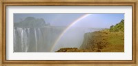 Rainbow form in the spray created by the water cascading over the Victoria Falls, Zimbabwe Fine Art Print