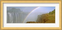 Rainbow form in the spray created by the water cascading over the Victoria Falls, Zimbabwe Fine Art Print