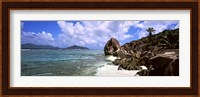 Rock formations on the beach on Anse Source d'Argent beach with Praslin Island in the background, La Digue Island, Seychelles Fine Art Print
