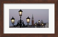 Lampposts lit up at dusk with building in the background, San Giorgio Maggiore, Venice, Italy Fine Art Print