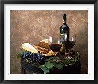 Still life of wine bottle, wine glasses, cheese and purple grapes on top of barrel Fine Art Print