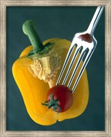 Close up of half yellow pepper with cherry tomato in center on fork tines Fine Art Print