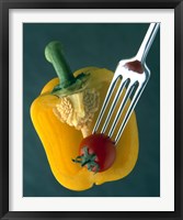 Close up of half yellow pepper with cherry tomato in center on fork tines Fine Art Print