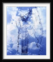Slow motion geyser of water rising through blue sky and clouds Fine Art Print