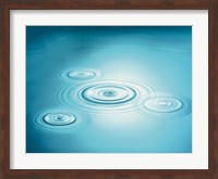Multiple rings in blue water with bright light reflection Fine Art Print