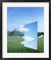 White clouds passing through a pale blue horizontal of sky with green grass, trees and sky in the distance Fine Art Print