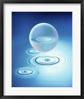 Sphere with water rings reflected in center floating above three rings in blue water Fine Art Print