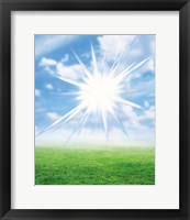Bright star like light floating in blue sky and clouds over green land Fine Art Print