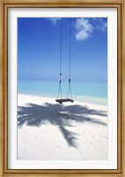 Swing on the beach above palm tree shadow Fine Art Print