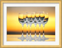 Row Of Wineglasses Against Golden Yellow shiny Background Fine Art Print