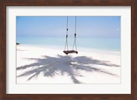 Beach swing and shadow of palm tree on sand Fine Art Print