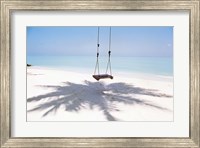 Beach swing and shadow of palm tree on sand Fine Art Print