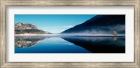 Reflection of a mountain with snowy trees on a lake in winter afternoon, Cote d'Azur, France Fine Art Print