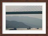 Container ships passing a newly constructed bridge on the Yangtze River, Wanzhou, Chongqing Province, China Fine Art Print