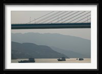 Container ships passing a newly constructed bridge on the Yangtze River, Wanzhou, Chongqing Province, China Fine Art Print