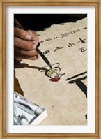 Chinese calligrapher painting calligraphy on a paper at the Dongba Place, Old Town, Lijiang, Yunnan Province, China Fine Art Print
