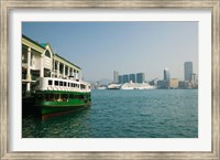 Star ferry on a pier with buildings in the background, Central District, Hong Kong Island, Hong Kong Fine Art Print