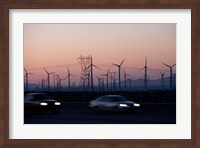 Cars moving on road with wind turbines in background at dusk, Palm Springs, Riverside County, California, USA Fine Art Print
