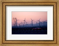 Car moving on a road with wind turbines in background at dusk, Palm Springs, Riverside County, California, USA Fine Art Print