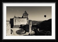Chateau de Castelnaud with hot air balloon flying over a valley, Castelnaud-la-Chapelle, Dordogne, Aquitaine, France Fine Art Print