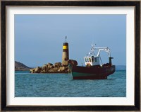 Fishing trawler in front of a lighthouse at Port Saint-Sauveur, Ile Grande, Cotes-d'Armor, Brittany, France Fine Art Print