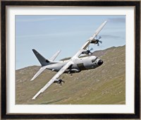 A C-130J Super Hercules low flying over North Wales on a training flight Fine Art Print