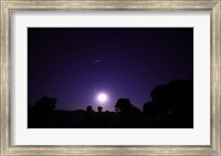 A bolide from the Geminids meteor shower above a setting moon in Mercedes, Argentina Fine Art Print