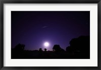 A bolide from the Geminids meteor shower above a setting moon in Mercedes, Argentina Fine Art Print