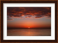 A layer of clouds is lit by the rising sun over Rio de la Plata, Buenos Aires, Argentina Fine Art Print
